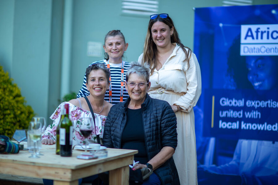 ZANOG community members at a sponsor stand